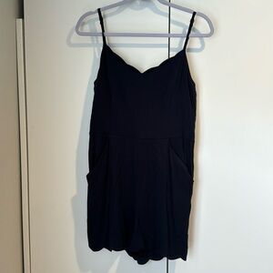 Navy blue scalloped romper.